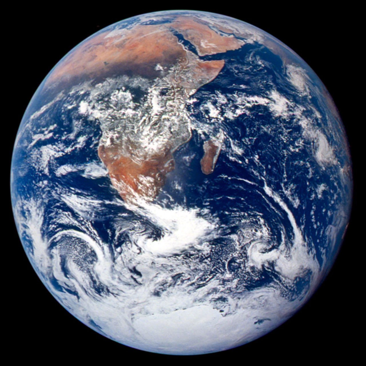 Apollo 17’s Blue Marble photograph, showing Earth against black space.
